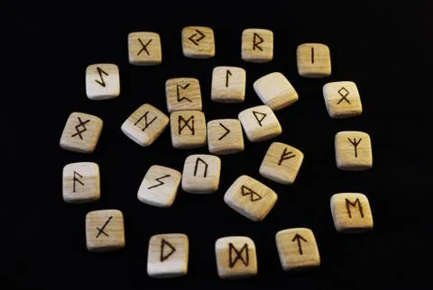 Runes on black background. Stock Photos