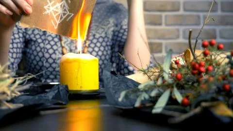 Runic magic. master burns runic spell on parchment 스톡 사진