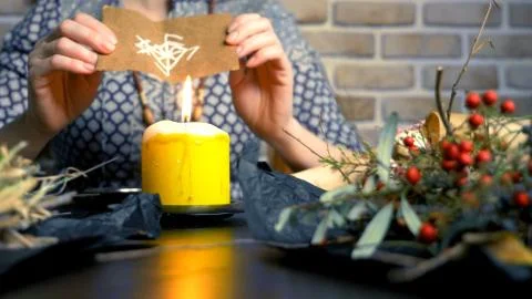 Runic magic. master burns runic spell on parchment 스톡 사진