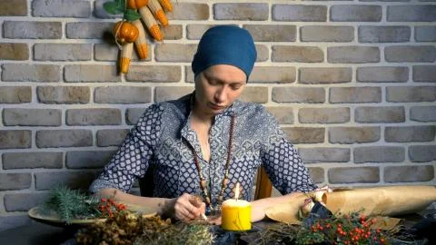 Runic magic. master writes runic spell on parchment Stock Photos