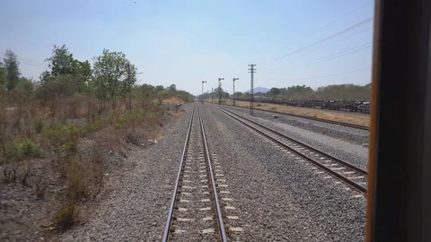 Runing train concept, last bogie bridge stairs on back train running on railway Stock Footage 122901731