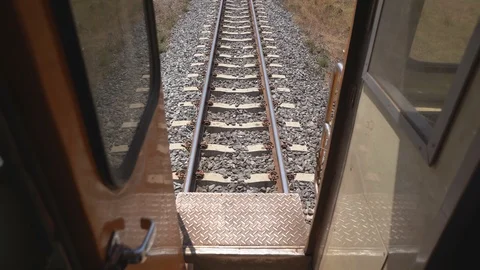 Runing train concept, last bogie bridge stairs on back train running Видео 122903135