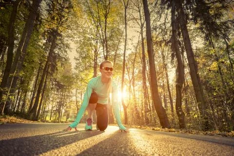 Runner in action at autumn. Stock Photos
