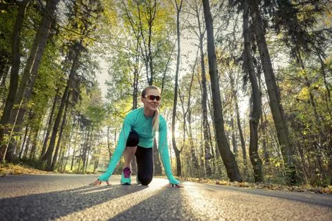 Runner in action at autumn. Stock Photos