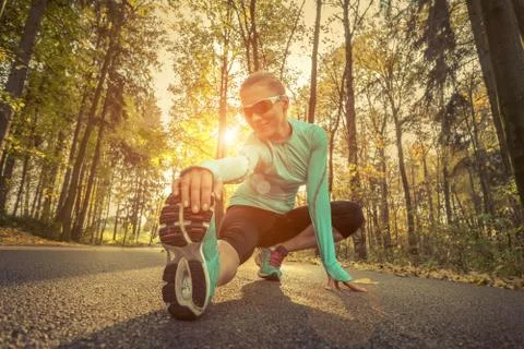 Runner in action at autumn. Stock Photos