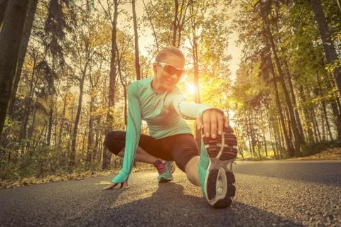 Runner in action at autumn. Stock Photos