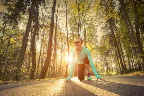 Runner in action at autumn. Stock Photos