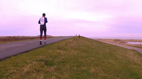 Runner and cyclists on the bike path. Stock Footage 34279695