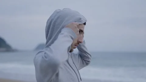 Runner arriving to beach and looking landscape Stock Footage 242158616