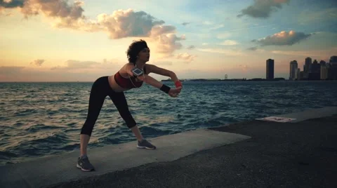 Runner athlete doing exersises at seaside Video stock 67600435