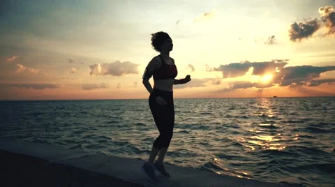 Runner athlete doing exersises at seaside Stock-Footage 67600665