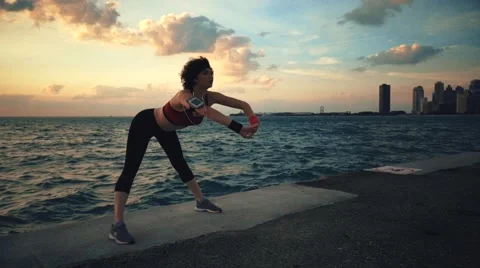 Runner athlete doing exersises at seaside Stock-Footage 67619952