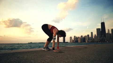 Runner athlete doing exersises at seaside Stock-Footage 67620032