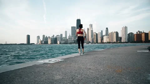 Runner athlete looking at skyscrapers on the background Stock-Footage 67601301