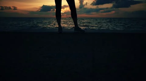 Runner athlete stands at seaside Stock-Footage 67395682