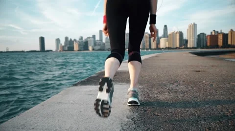 Runner athlete start running at seaside with skyscrapers on the background Stock-Footage 67601099