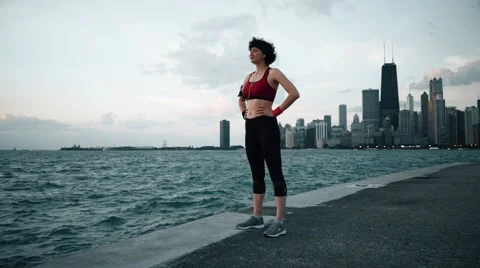 Runner athlete taking a breath and smiling at seaside Stock-Footage 67600012