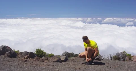 Runner Athlete Tying Shoelaces Going Running On Mountain Above Clouds Stock Footage 78955369