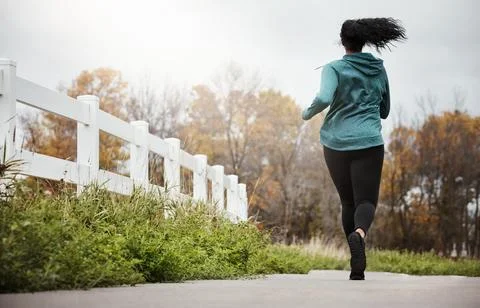 Runner, back of woman and path with workout, fitness and exercise routine w.. Stock Photos