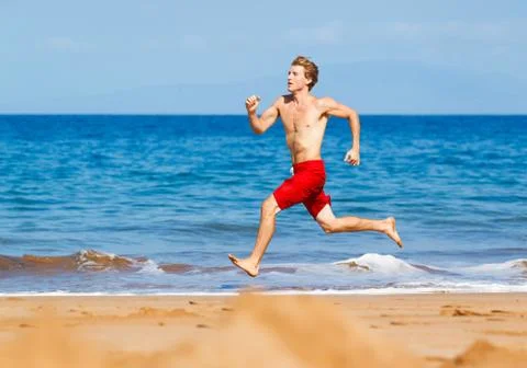 Runner on beach Stock Photos