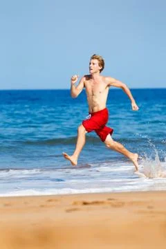 Runner on beach Stock Photos