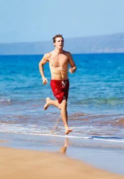 Runner on beach Stock Photos