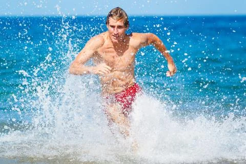 Runner on beach Stock Photos