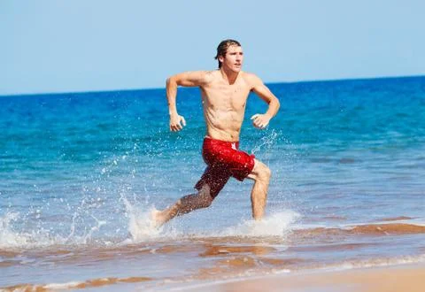 Runner on beach Stock Photos