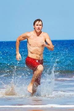 Runner on beach Stock Photos