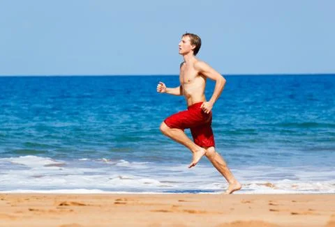 Runner on beach Stock Photos