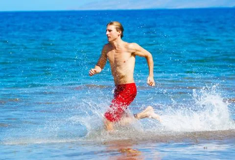 Runner on beach Stock Photos