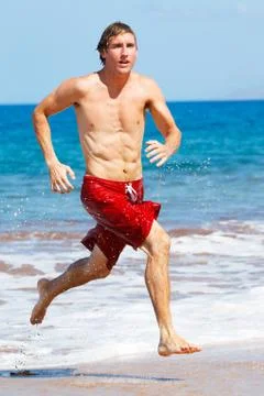 Runner on beach Stock Photos