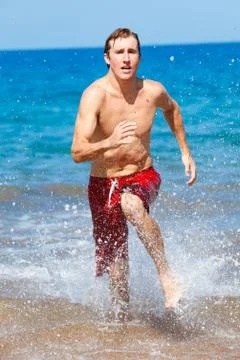 Runner on beach Stock Photos