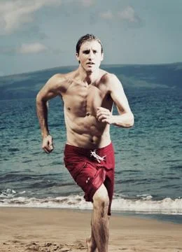 Runner on beach Stock Photos