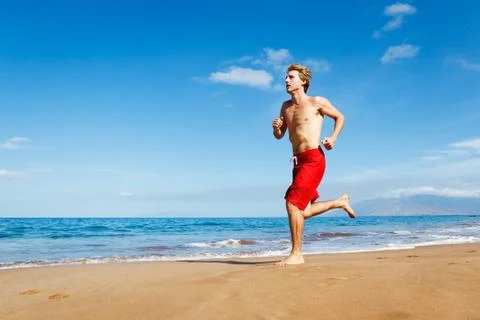 Runner on beach Stock Photos