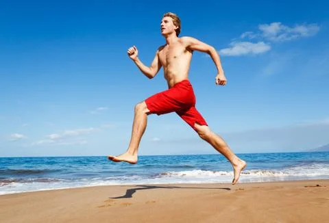 Runner on beach Stock Photos