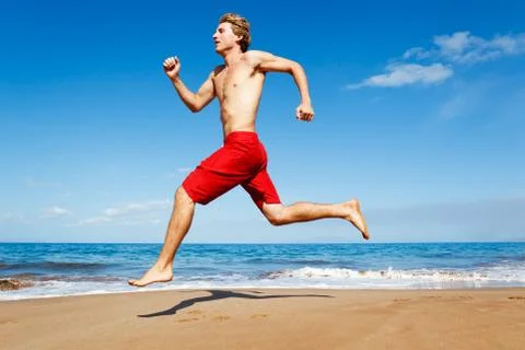 Runner on beach Stock Photos
