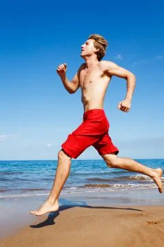 Runner on beach Stock Photos