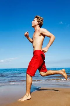 Runner on beach Stock Photos