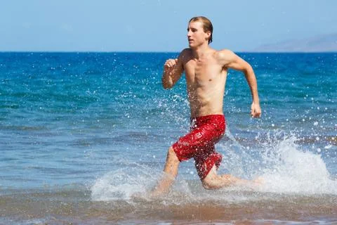 Runner on beach Stock Photos