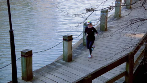 Runner on boardalk Stock Footage 234243345