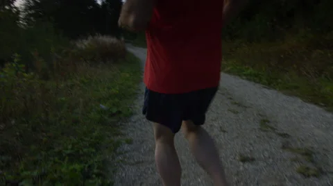 Runner celebrates getting to the end of his run in the mountains Stock Footage 63011804