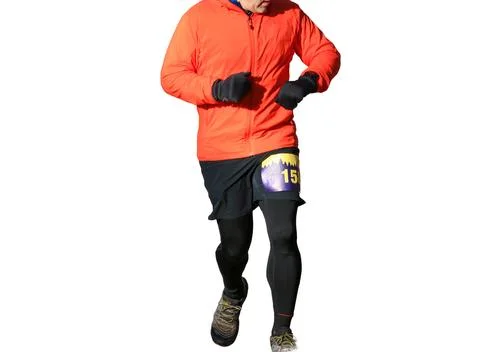 Runner Competing in a Running Race on a Cold Day Stock Photos