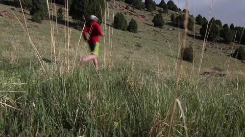 Runner Crossing a Mountainside Video stock 51333223