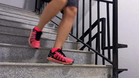 Runner descending stairs, low angle close-up Stock Footage 346743160