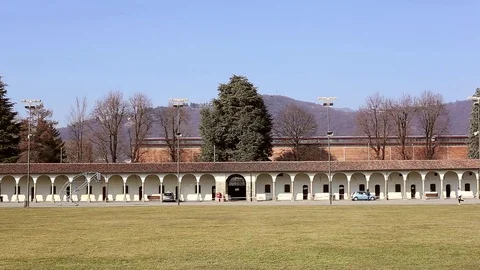 Runner in distance in front of a Colonnade. right to left. Stock Footage 72954855