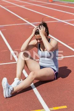 Runner distressed at injury Stock Photos