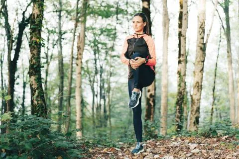Runner doing warm up Stock Photos