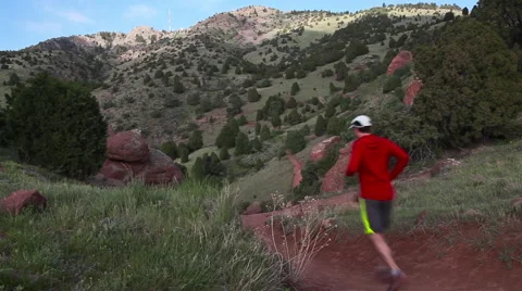 Runner Exercising on Red Mountain Trail Video stock 51333233