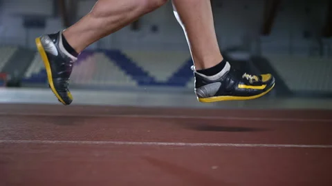 Runner feet on treadmill in indoor stadium Stock Footage 119501336